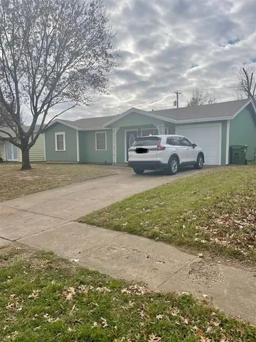 a house view with a garden space