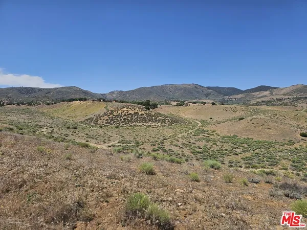 a view of an outdoor space with mountain view
