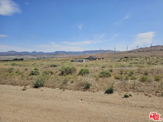 a view of ocean with a mountain