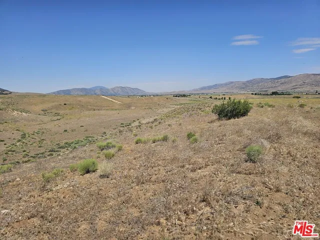 a view of mountain and an ocean