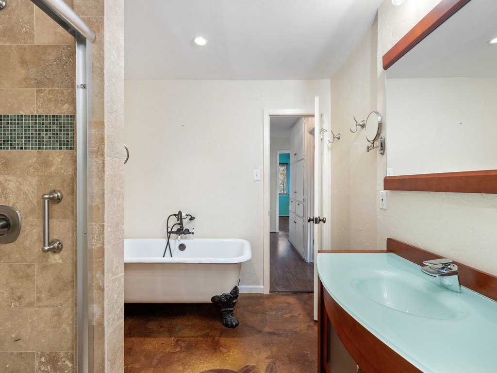 4711 Fieldstone Drive Austin, TX 78735 - Photo 16 of 40 Full bathroom with a shower stall, a soaking tub, vanity, finished concrete flooring, and recessed lighting