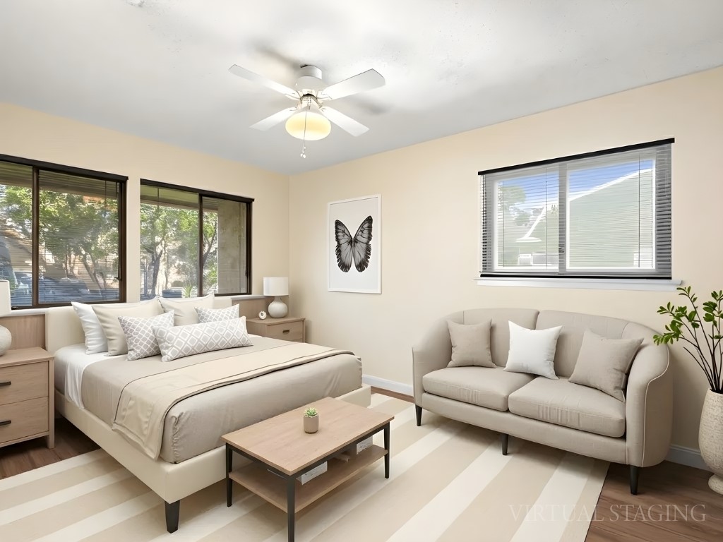 4711 Fieldstone Drive Austin, TX 78735 - Photo 17 of 40 a bedroom with a large bed couch and a window