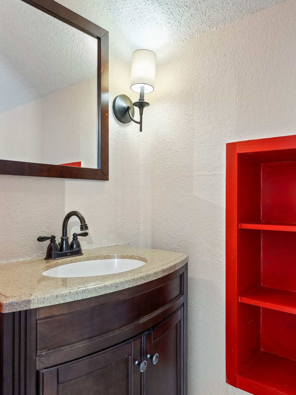 4711 Fieldstone Drive Austin, TX 78735 - Photo 19 of 40 a bathroom with a sink a vanity and a mirror