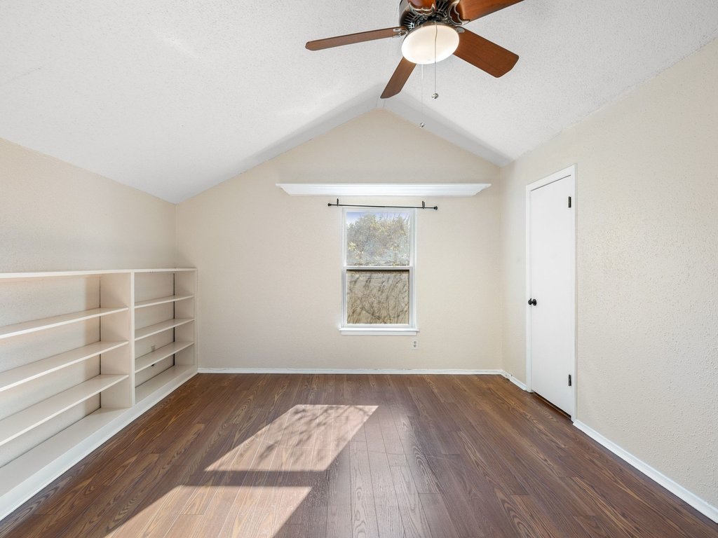 4711 Fieldstone Drive Austin, TX 78735 - Photo 21 of 40 wooden floor in an empty room with a window