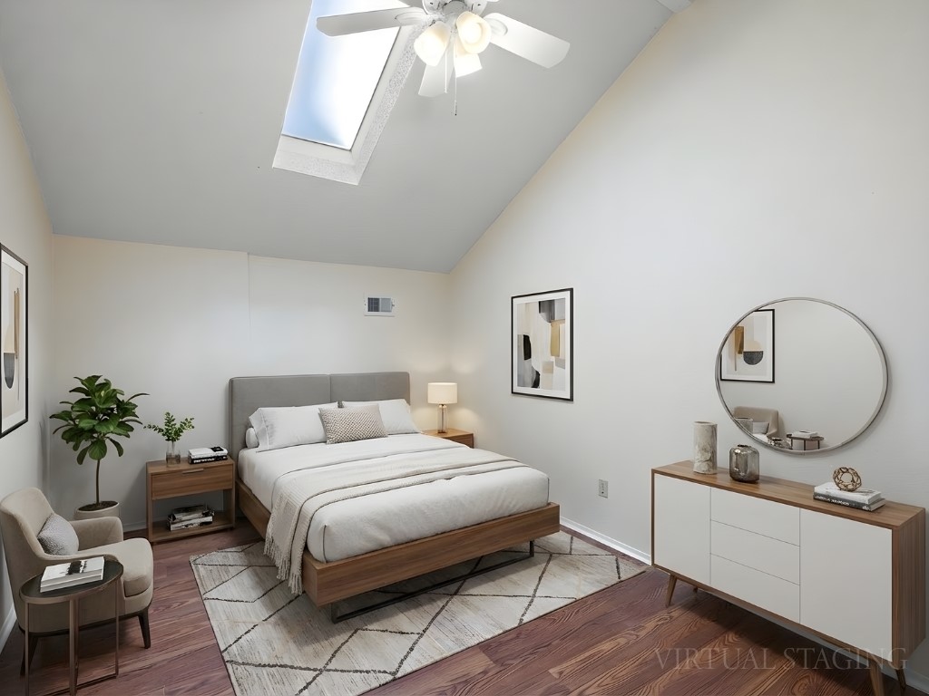 4711 Fieldstone Drive Austin, TX 78735 - Photo 24 of 40 Bedroom with lofted ceiling, a skylight, wood finished floors, and ceiling fan