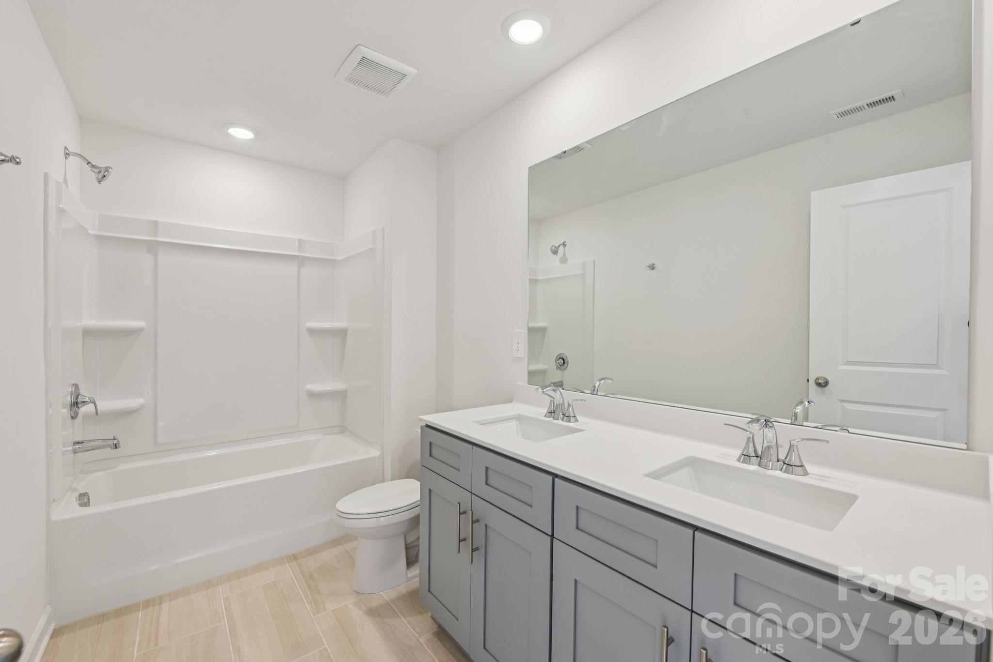 178 Murphy Mdw Road Mocksville, NC 27028 - Photo 13 of 22 a bathroom with a sink a toilet and shower