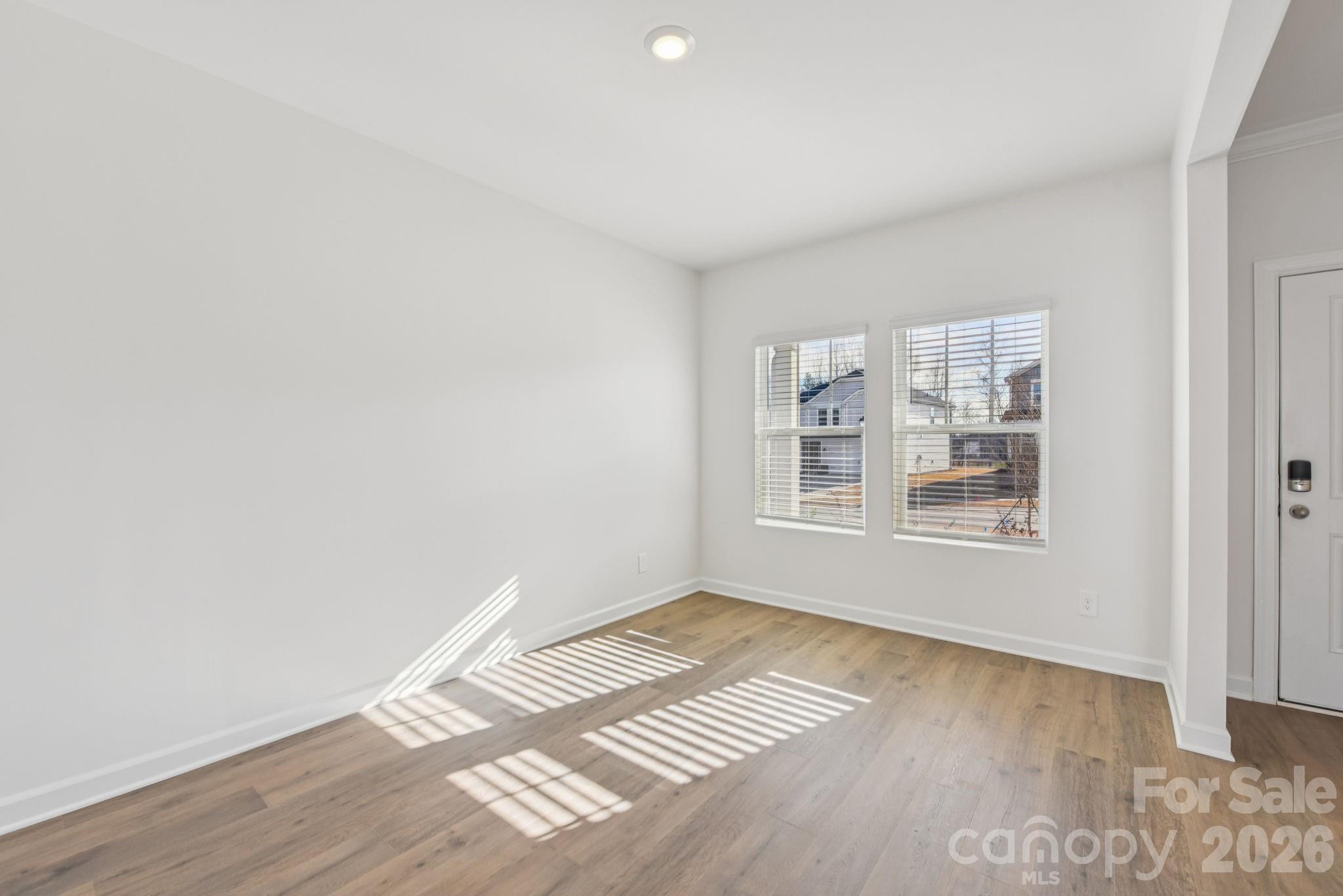 178 Murphy Mdw Road Mocksville, NC 27028 - Photo 3 of 22 a view of an empty room with wooden floor and a window