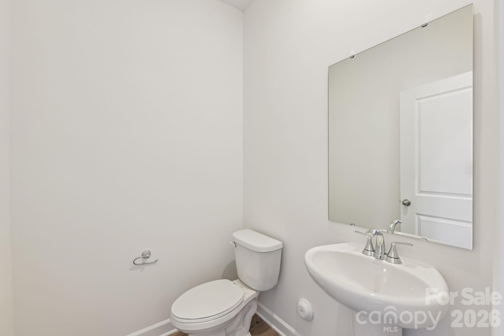 178 Murphy Mdw Road Mocksville, NC 27028 - Photo 8 of 22 a bathroom with a sink a toilet and a mirror