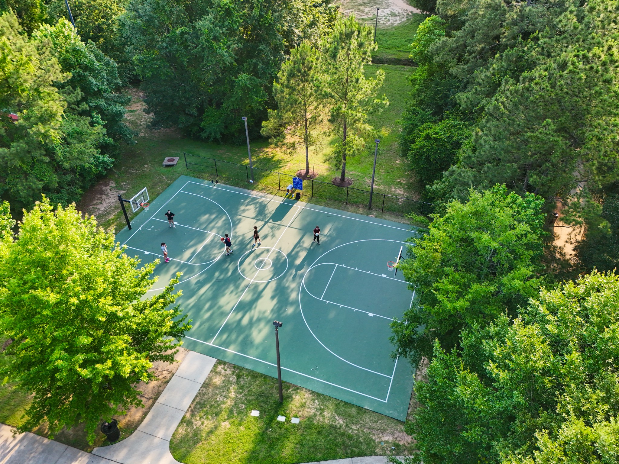 334 Topper Pines Drive Montgomery, TX 77316 - Photo 46 of 49 Woodforest’s basketball court adds another way to stay active close to home, with the court tucked among the trees near the community’s larger mix of pools, trails, and sports courts.