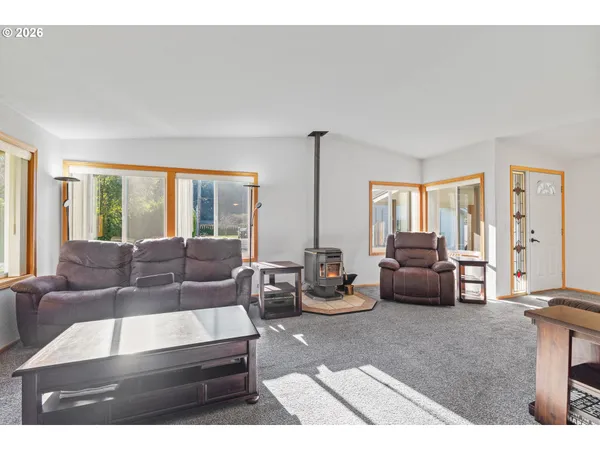 a living room with furniture and a window
