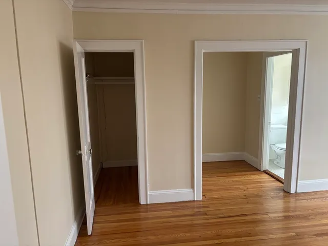 an empty room and wooden door