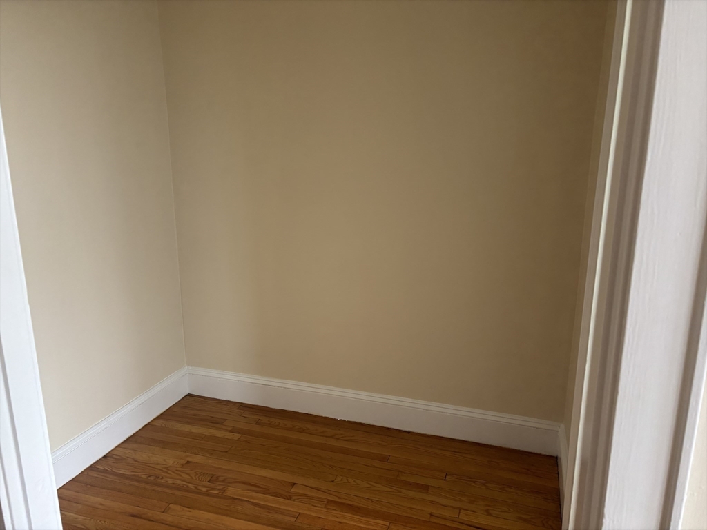50 Broadway, Unit 46 Beverly, MA 01915 - Photo 4 of 7 a view of a small space with wooden floor and a window