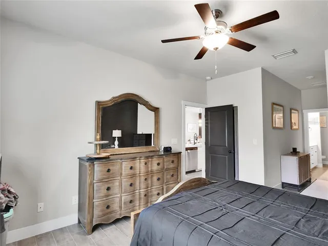 a bedroom with a bed and a dresser