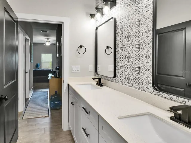 a bathroom with a sink and a mirror