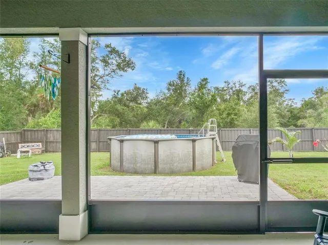 a view of a swimming pool with a yard