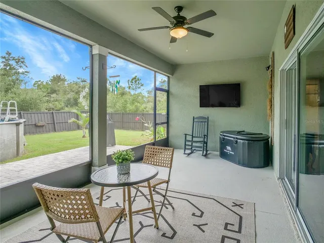 a view of a livingroom with furniture and a flat screen tv