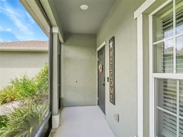 a view of a hallway with windows