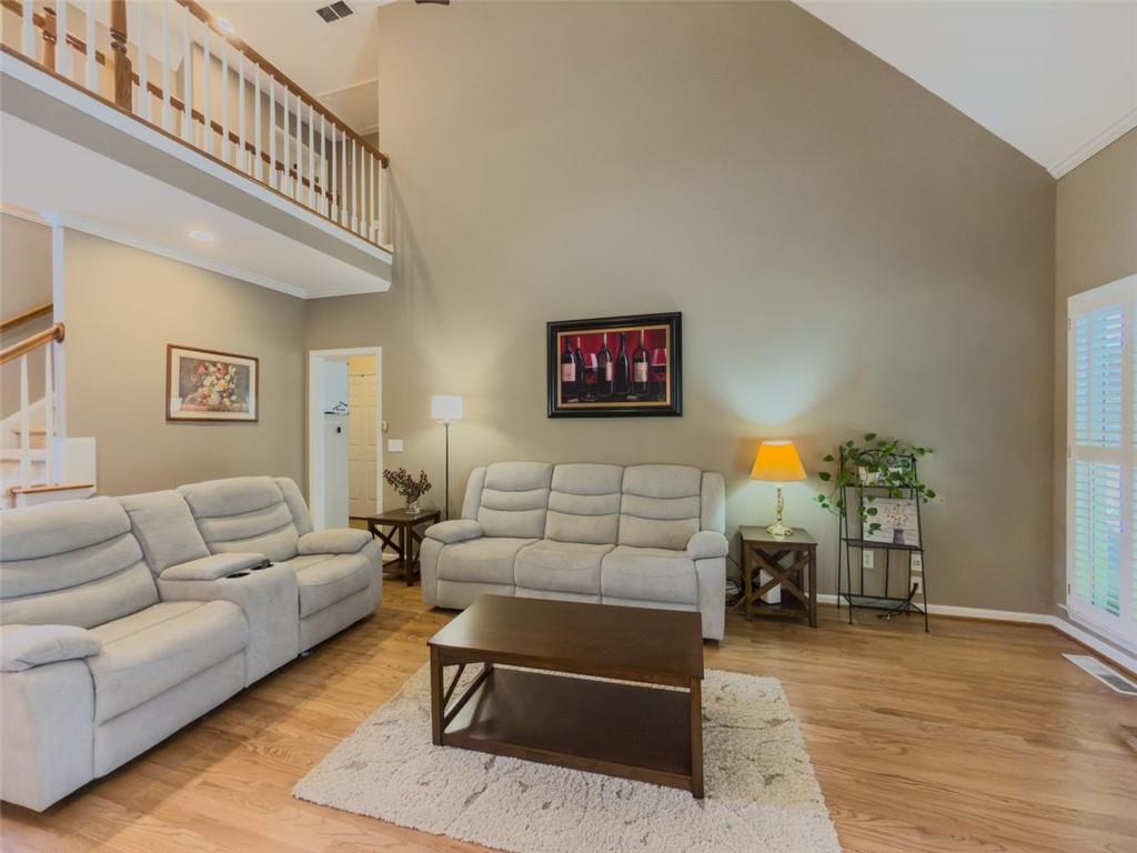 1739 Praters Point Dacula, GA 30019 - Photo 12 of 48 a living room with furniture and a table