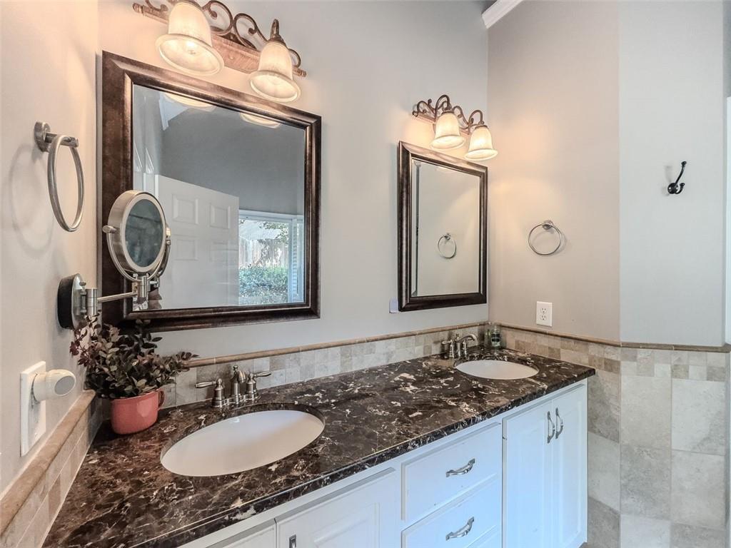 1739 Praters Point Dacula, GA 30019 - Photo 19 of 48 a bathroom with a granite countertop sink and a mirror
