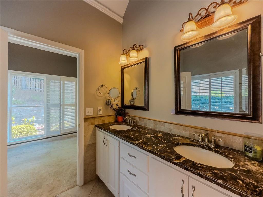 1739 Praters Point Dacula, GA 30019 - Photo 20 of 48 a bathroom with a granite countertop double vanity sink and a mirror