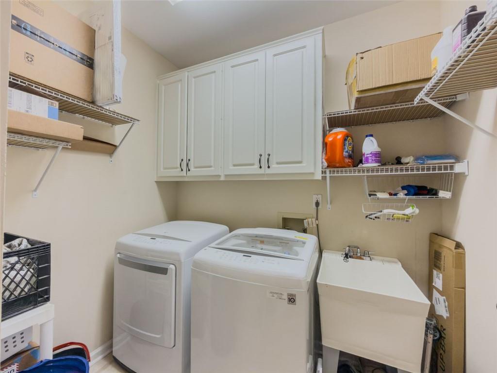 1739 Praters Point Dacula, GA 30019 - Photo 22 of 48 a utility room with dryer and washer
