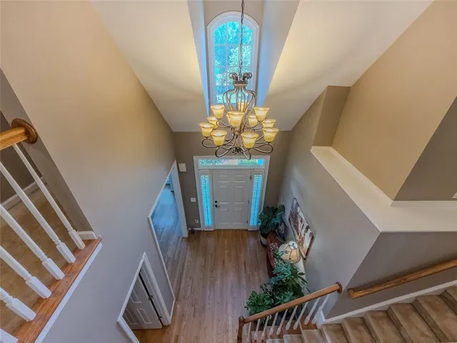 a view of an entryway with wooden floor