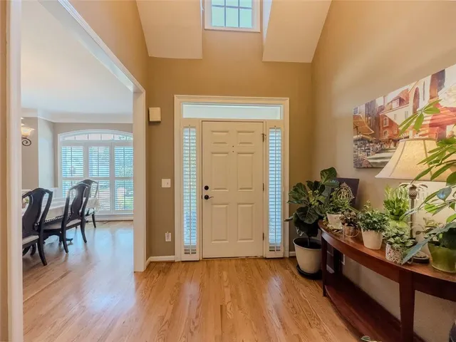 a view of a entryway with furniture and wooden floor