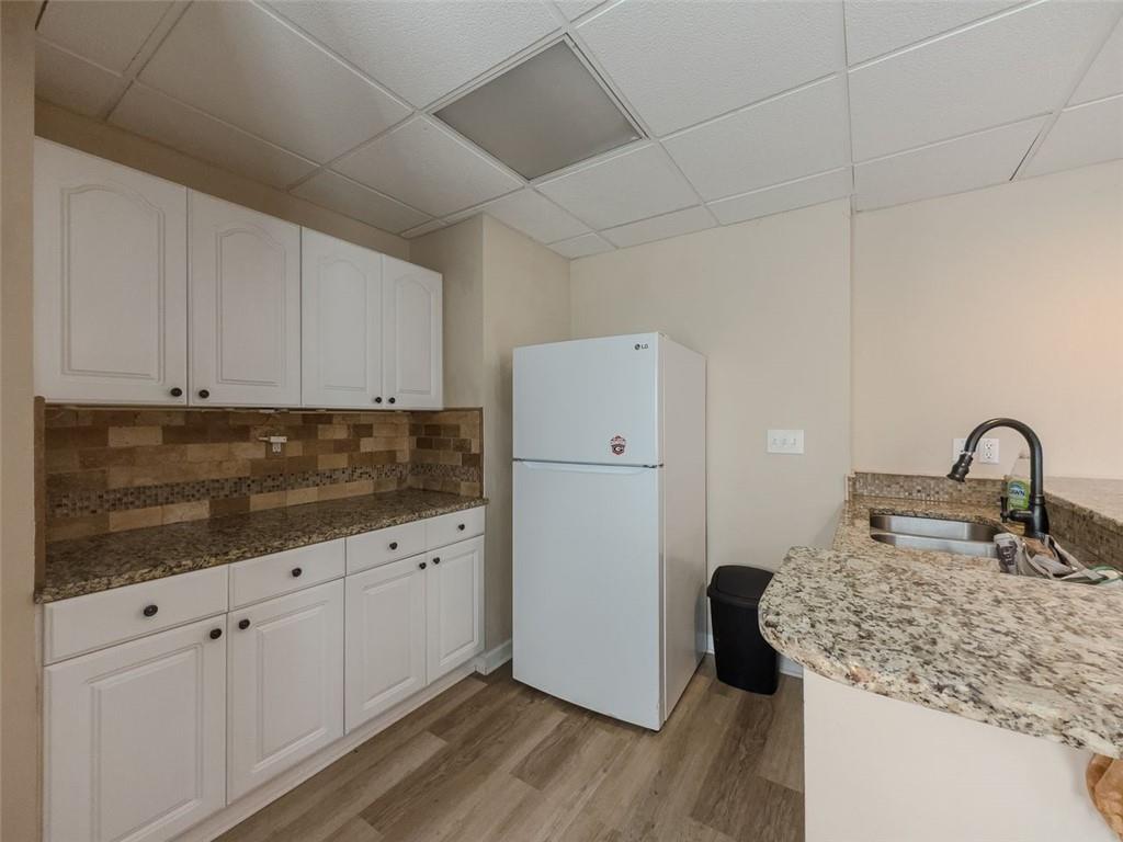 1739 Praters Point Dacula, GA 30019 - Photo 35 of 48 a kitchen with white cabinets appliances and sink