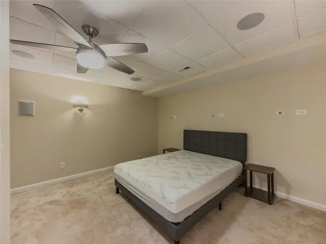 a bedroom with a bed and a table