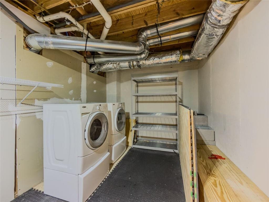 1739 Praters Point Dacula, GA 30019 - Photo 40 of 48 a utility room with dryer and washer