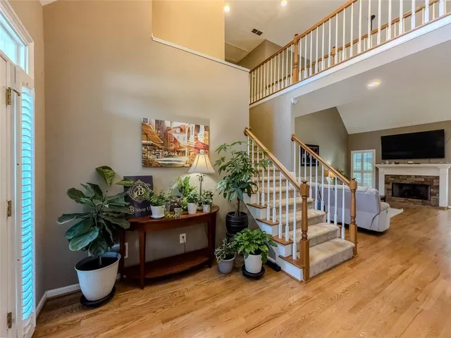 a living room with furniture and a potted plant