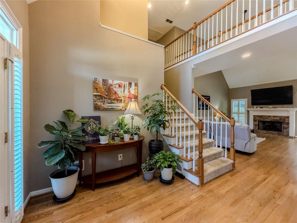 1739 Praters Point Dacula, GA 30019 - Photo 4 of 48 a living room with furniture and a potted plant