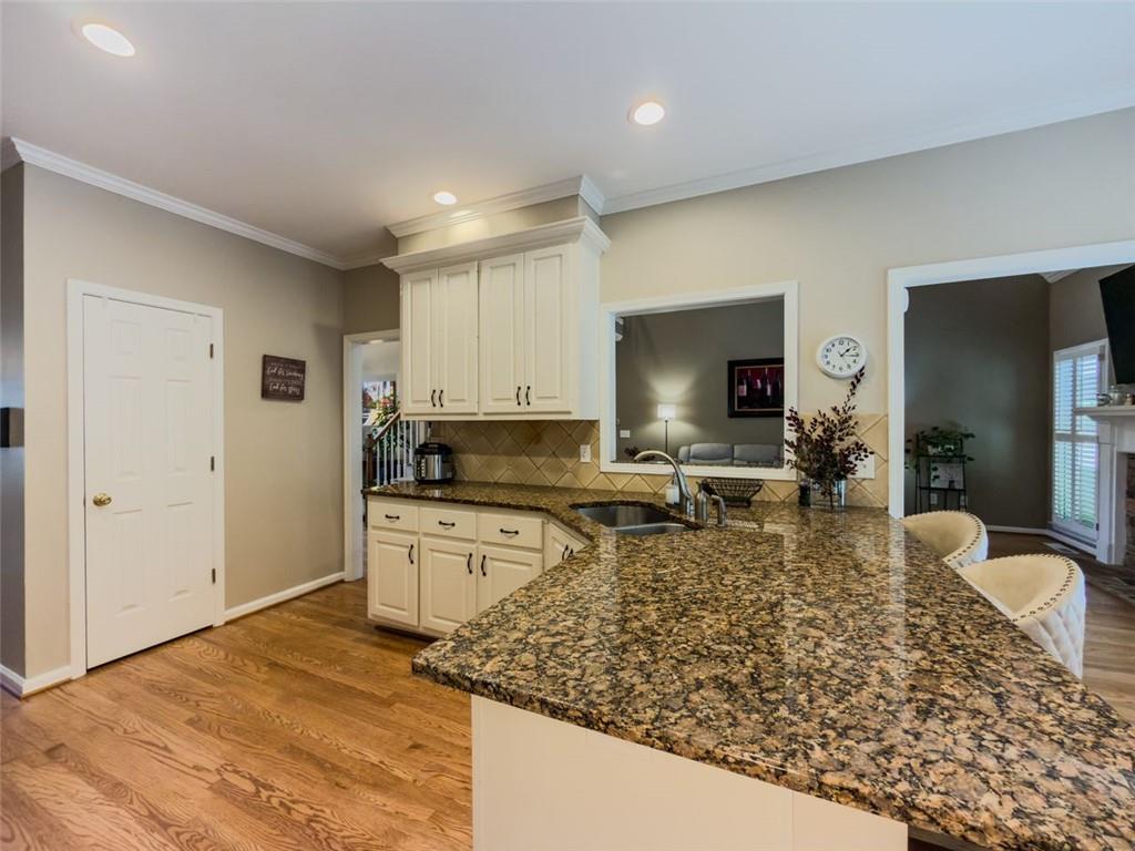1739 Praters Point Dacula, GA 30019 - Photo 9 of 48 a kitchen with a sink stove and refrigerator