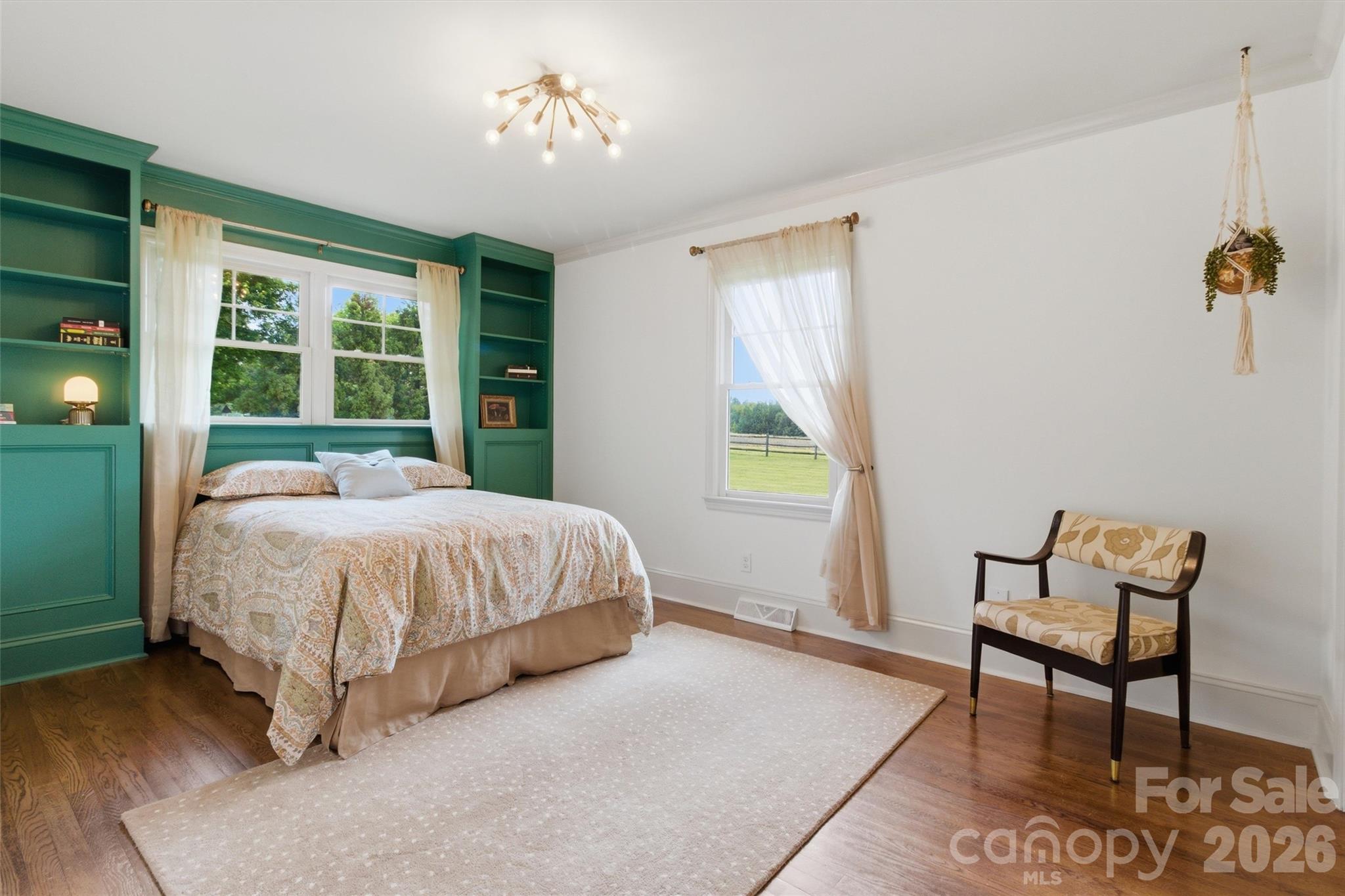 4712 Secrest Short Cut Road Monroe, NC 28110 - Photo 17 of 30 a spacious bedroom with a bed and a window
