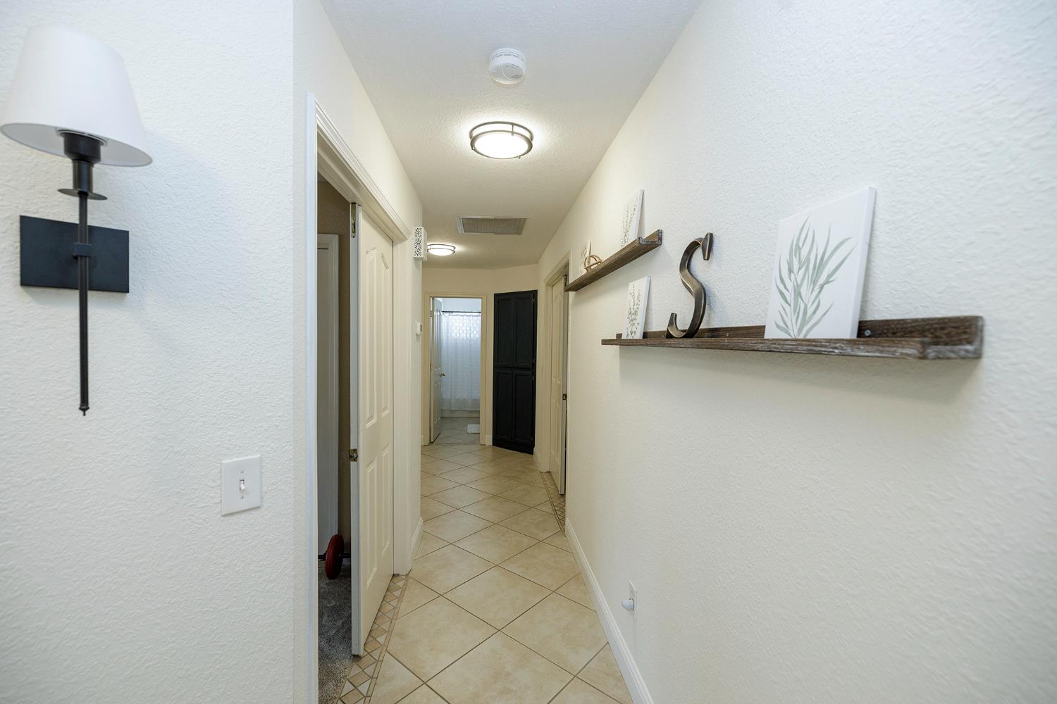230 Meyenberg Avenue Ripon, CA 95366 - Photo 29 of 52 a view of a hallway with closet