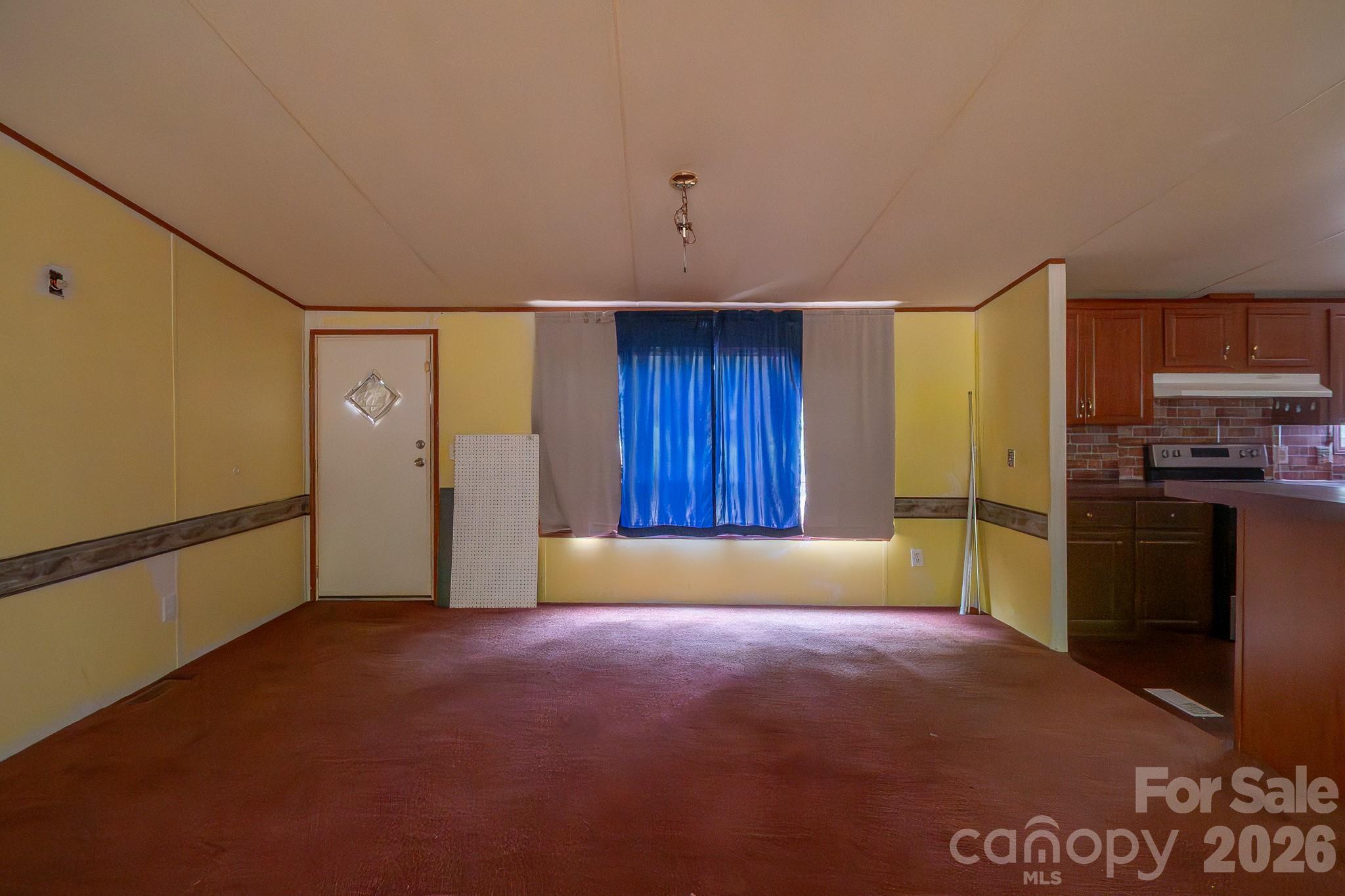 3133 Magnolia Road Bennettsville, SC 29512 - Photo 15 of 41 a view of an empty room with a kitchen