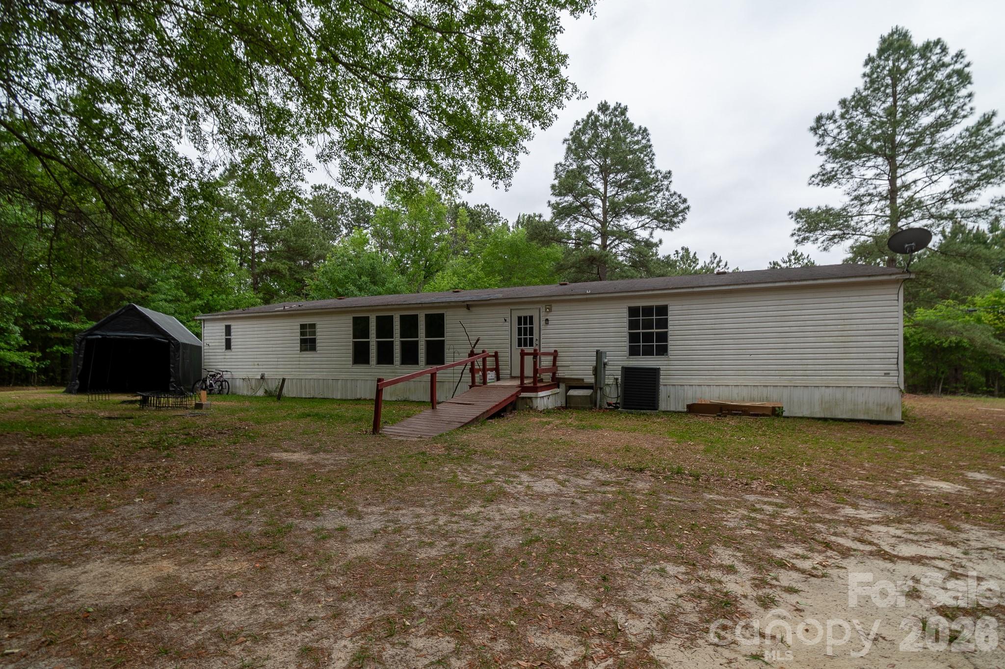3133 Magnolia Road Bennettsville, SC 29512 - Photo 4 of 41 a view of a house with a backyard