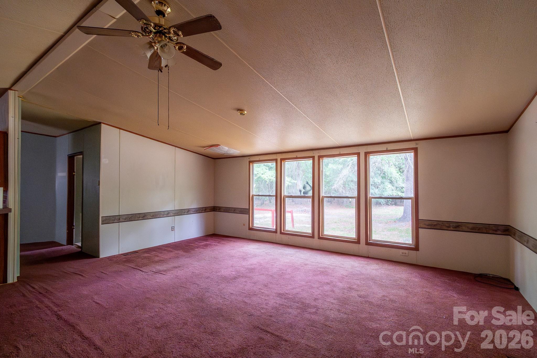 3133 Magnolia Road Bennettsville, SC 29512 - Photo 8 of 41 a view of an empty room with a window
