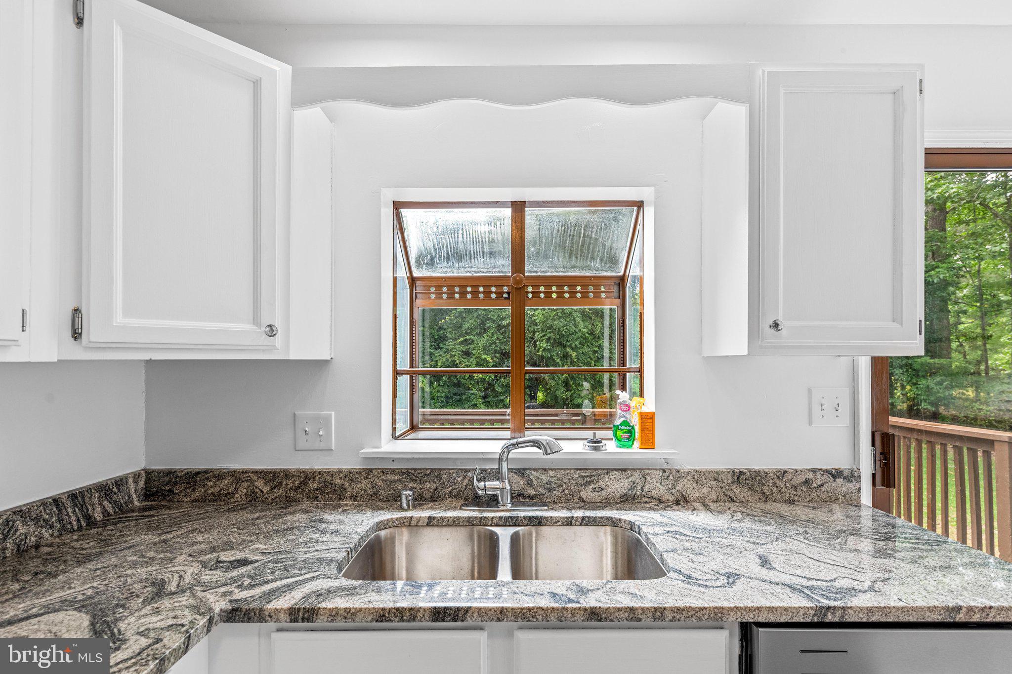 15 Raft Road Ocean Pines, MD 21811 - Photo 36 of 53 a kitchen with granite countertop a sink and a window