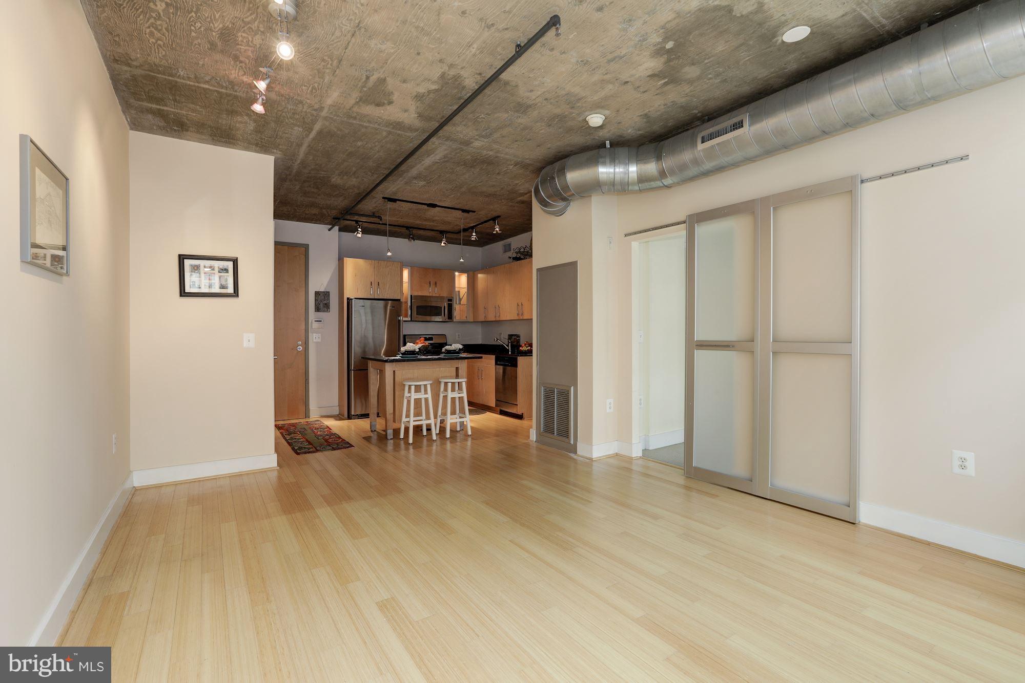 1444 Church Street Northwest, Unit 206 Washington, DC 20005 - Photo 9 of 22 a view of kitchen with furniture and refrigerator