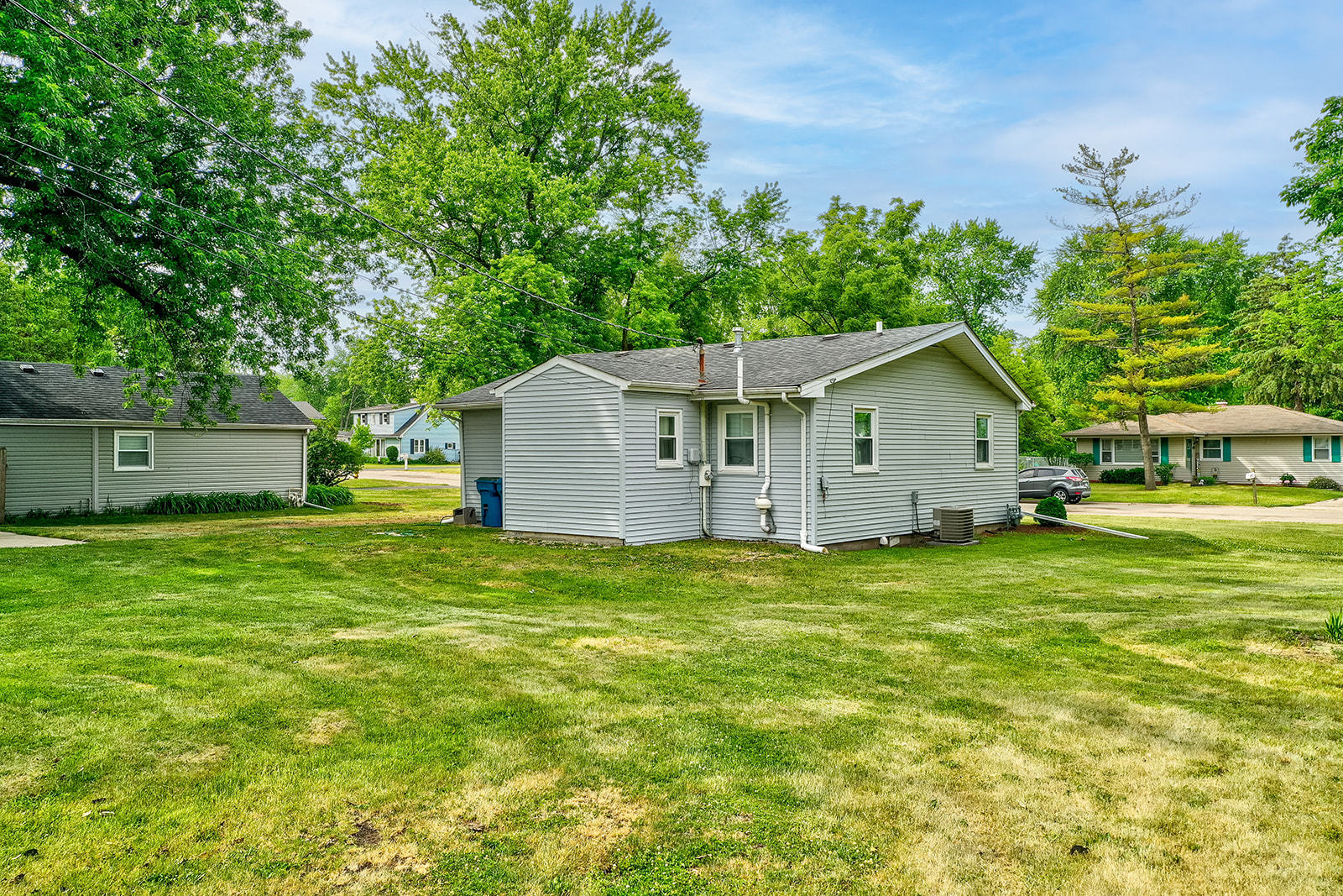 2134 Root Street Crest Hill, IL 60403 - Photo 16 of 17 a backyard of a house with plants and large trees