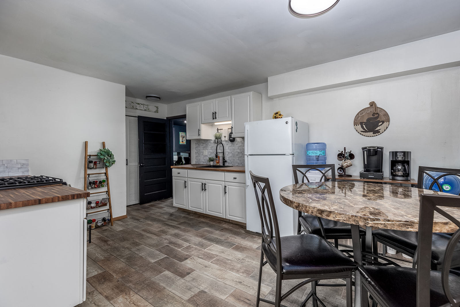 2134 Root Street Crest Hill, IL 60403 - Photo 6 of 17 a kitchen with refrigerator cabinets and wooden floor