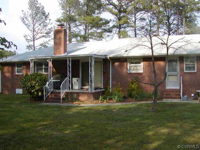 10708 South Crater Road Petersburg, VA 23805 - Photo 1 of 3 a front view of house with yard and green space