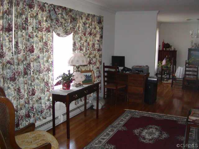 10708 South Crater Road Petersburg, VA 23805 - Photo 3 of 3 a living room with furniture and a fireplace