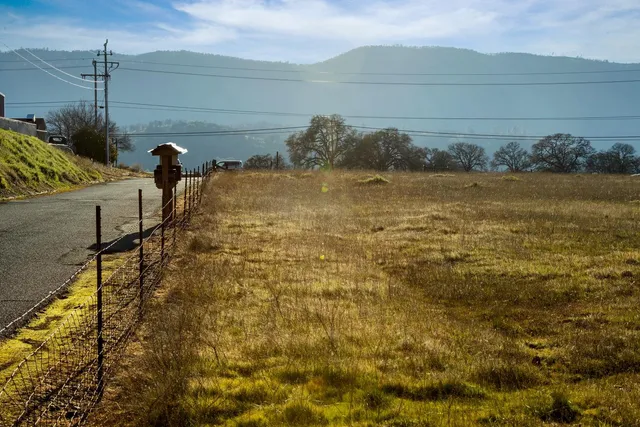 a view of a swimming pool and a yard