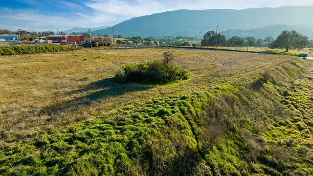 a view of a large body of water with a house in the background