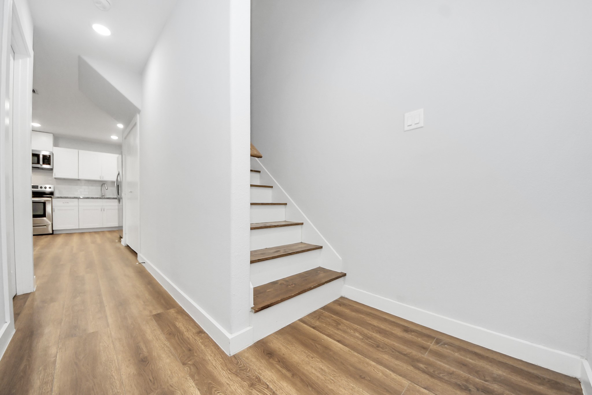 6609 Bacher Street, Unit A Houston, TX 77028 - Photo 21 of 33 a view of a kitchen with wooden floor and entryway