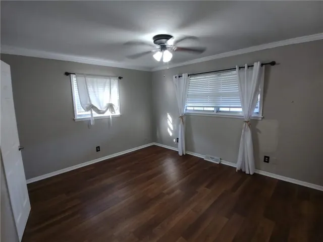 a white toilet sitting next to a shower curtain