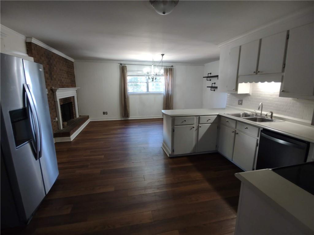 1 Westlyn Drive Rome, GA 30165 - Photo 4 of 26 a kitchen with stainless steel appliances granite countertop a sink stove and refrigerator