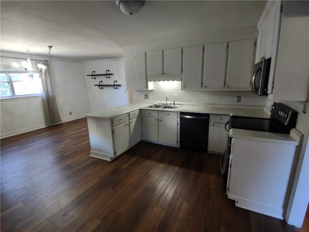 1 Westlyn Drive Rome, GA 30165 - Photo 6 of 26 a kitchen with a sink and cabinets